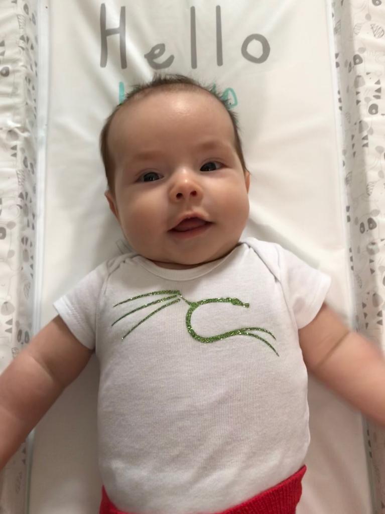 A baby in a Kali Linux onesie